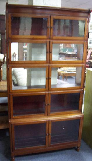 Appraisal: A mahogany five-section bookcase each section enclosed by a pair