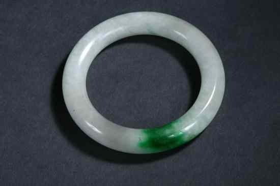 Appraisal: CHINESE CARVED WHITE AND GREEN JADEITE BANGLE - diam