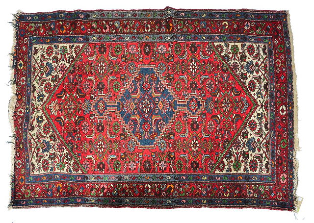 Appraisal: Hamadan white ground rugwith floral and other motifs within a