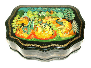 Appraisal: A Russian lacquer box of shaped outline and with red