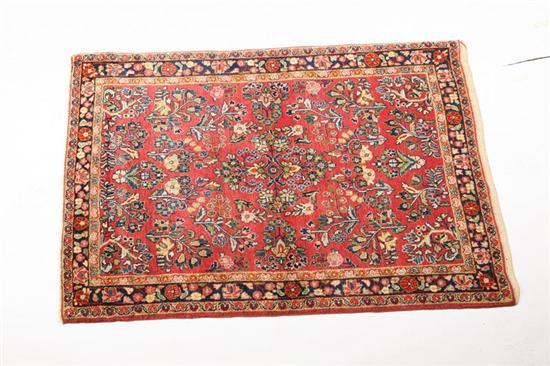 Appraisal: ORIENTAL RUG Sarouk Dark blue border and salmon ground with