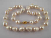 Appraisal: A South Sea cultured pearl necklace with a yellow metal