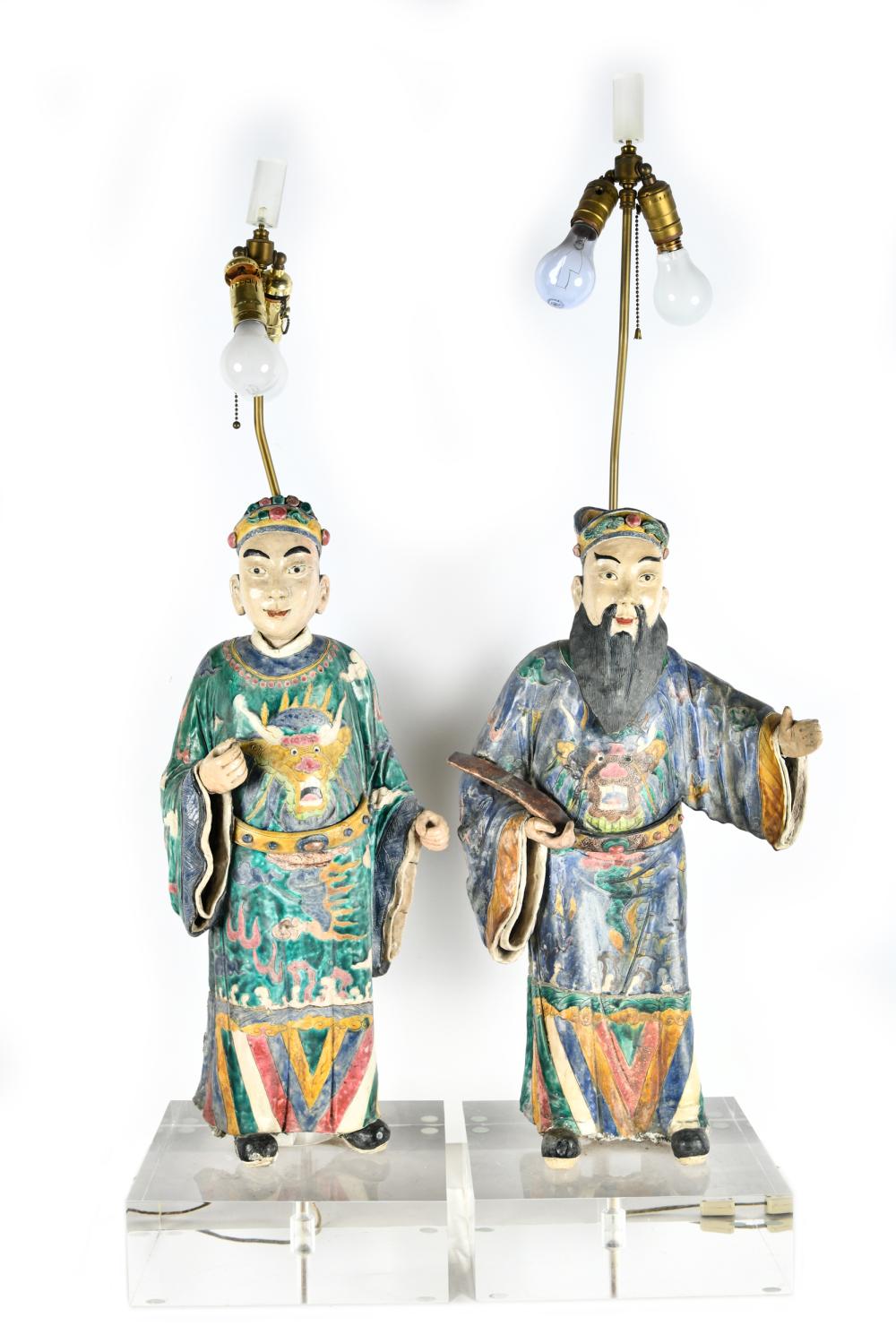 Appraisal: PAIR OF CHINESE CERAMIC FIGURESmounted as table lamps on square