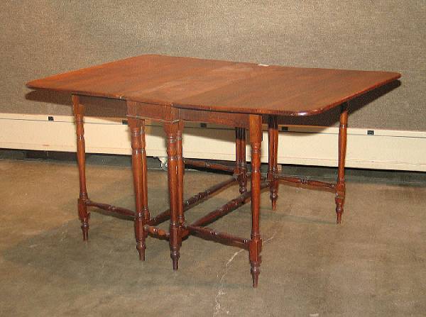 Appraisal: A William and Mary style golden oak drop leaf table