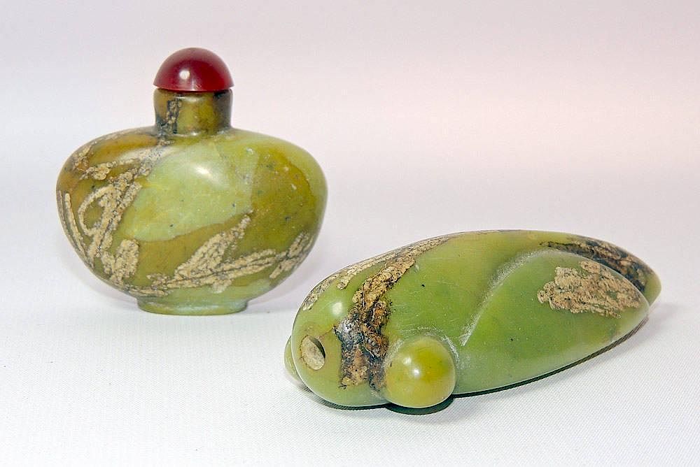 Appraisal: Two Green and Russet Jade Snuff Bottles Two green and