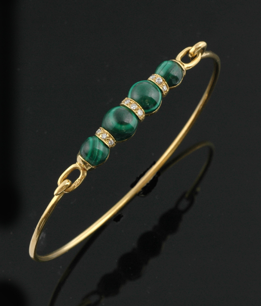 Appraisal: A malachite and diamond bangle The ct gold flexible bangle