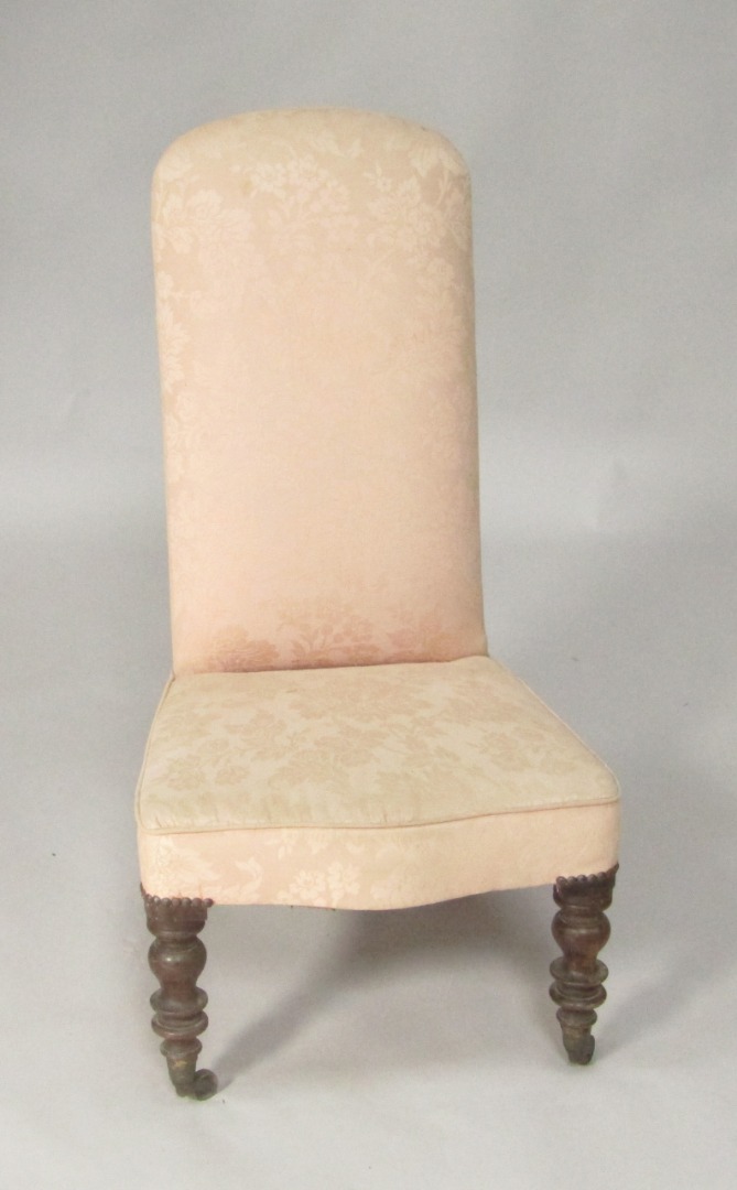 Appraisal: A Victorian mahogany nursing chair upholstered in pink patterned draylon