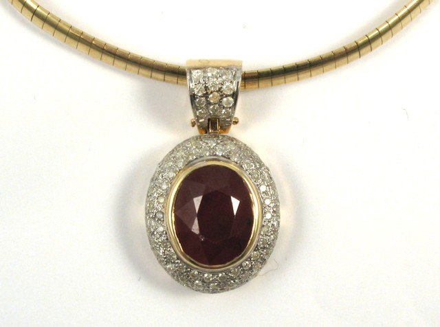 Appraisal: RUBY AND DIAMOND PENDANT NECKLACE The pendant is suspended on