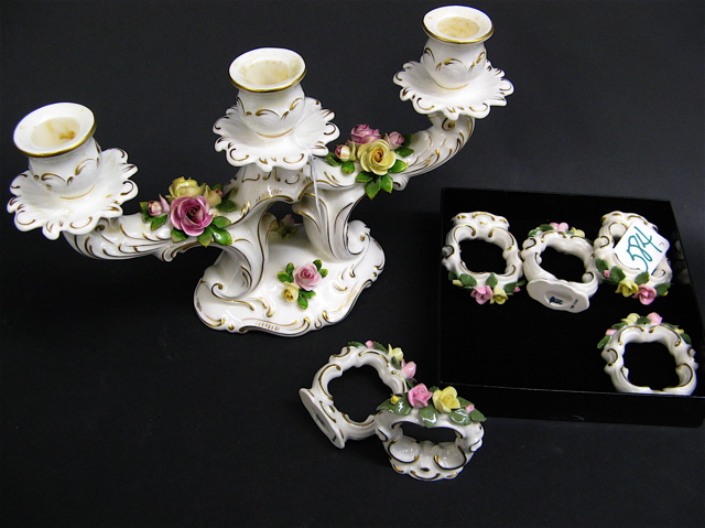 Appraisal: SEVEN GERMAN PORCELAIN TABLE ITEMS decorated with applied roses having