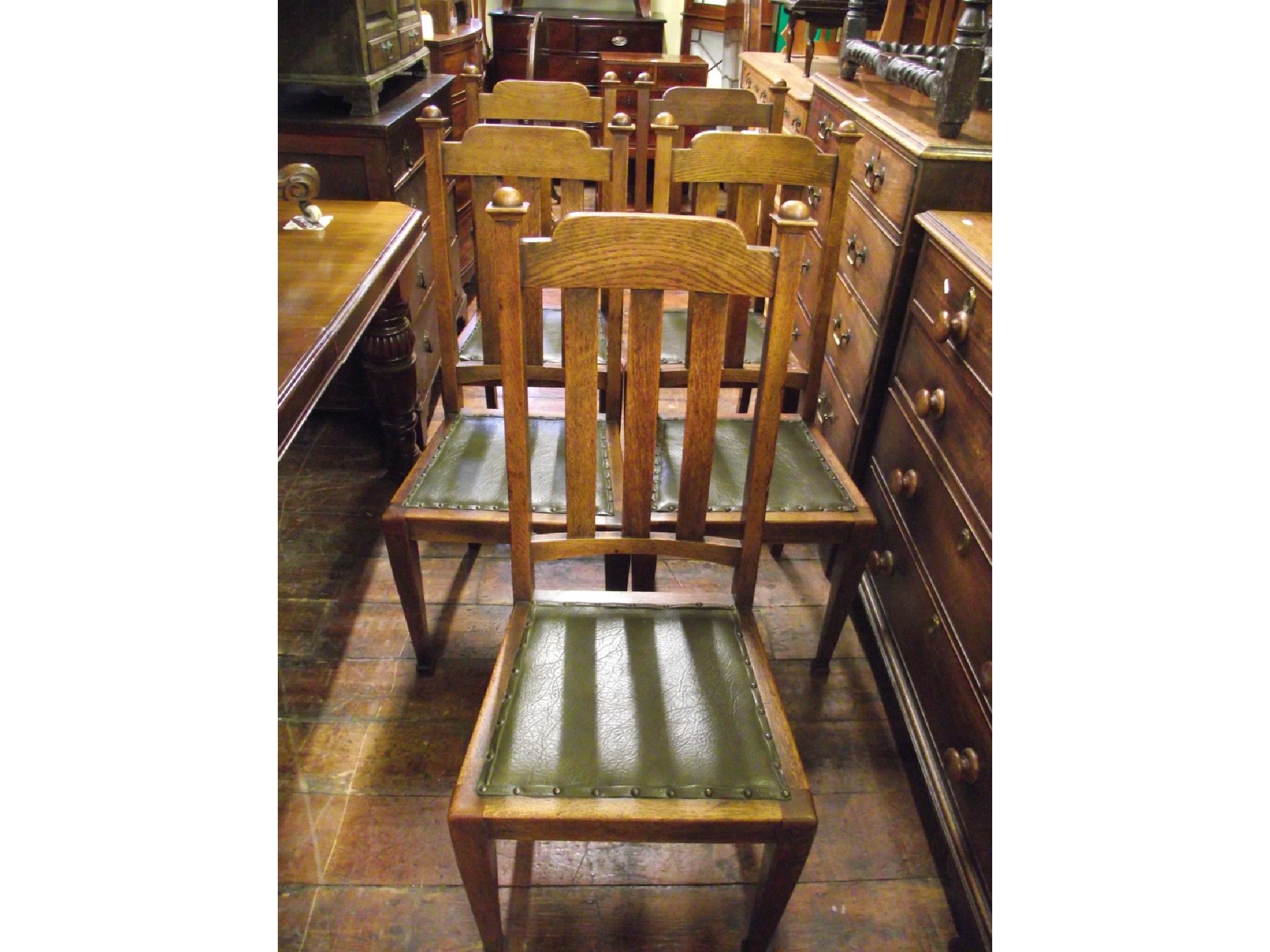 Appraisal: A set of six oak dining chairs with stick backs