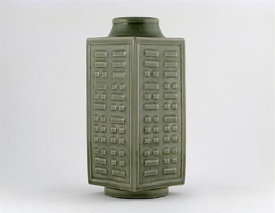 Appraisal: A Chinese celadon glazed cong the sides moulded with the