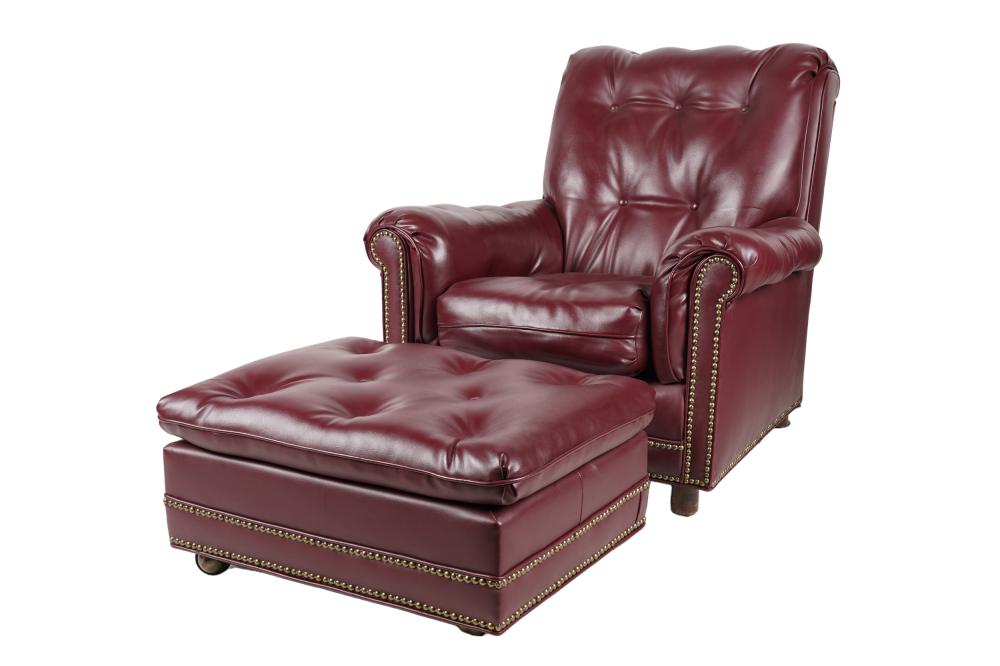 Appraisal: BURGUNDY LEATHER CHAIR OTTOMANunsigned the ottoman raised on casters Condition