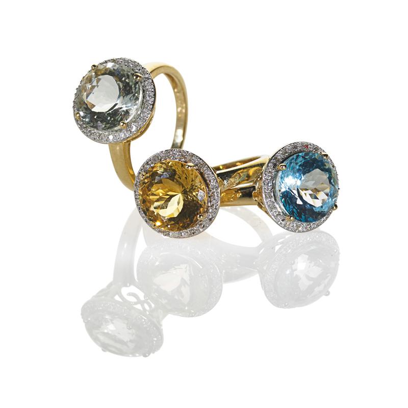 Appraisal: THREE GEM-SET DIAMOND K YELLOW GOLD STACKING RINGS Round faceted