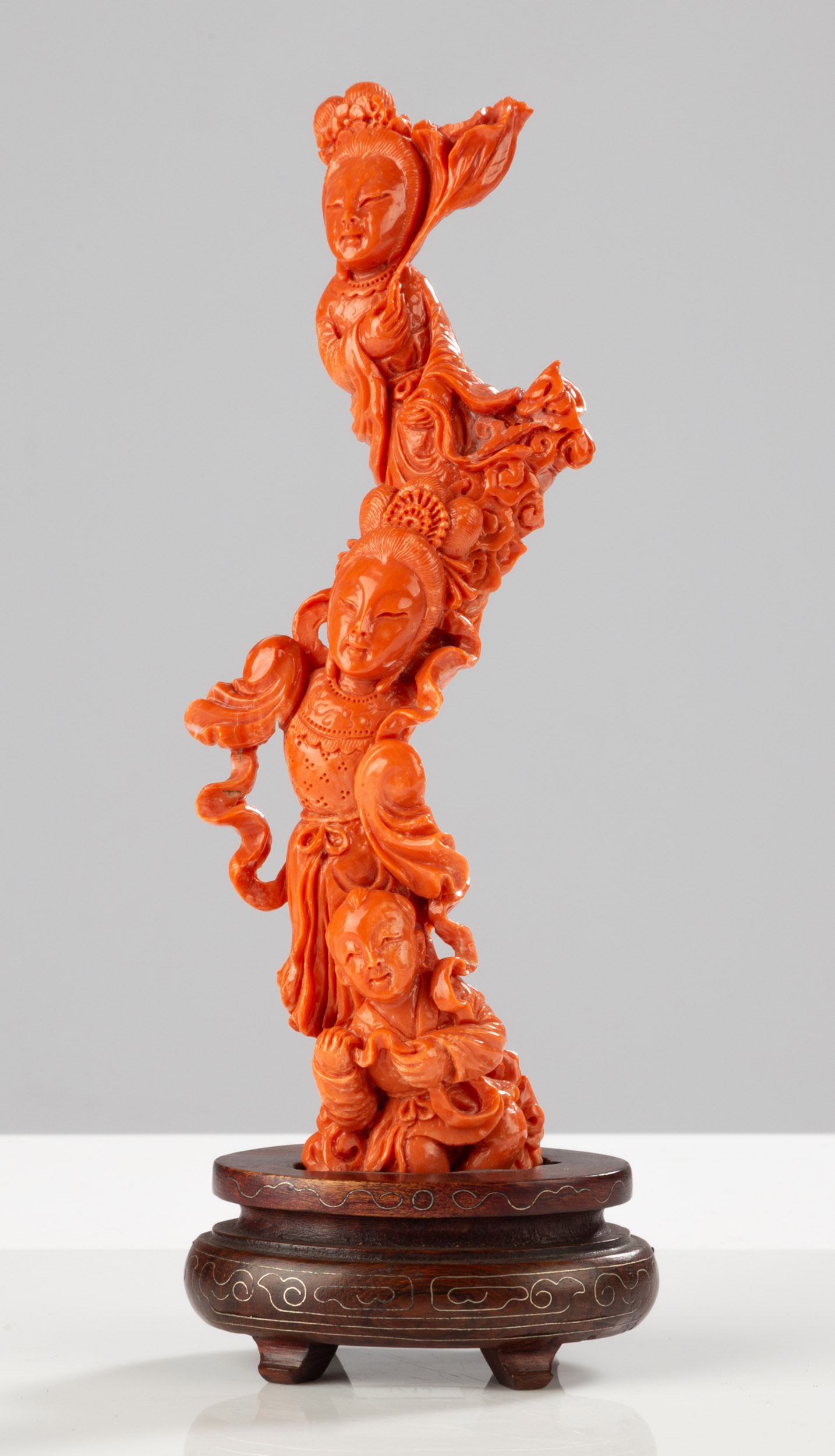 Appraisal: CHINESE CORAL IMMORTALS CARVING circa Carved in a single sinuous