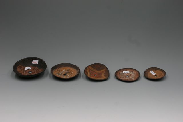 Appraisal: A group of five carved coconut disks village game collected