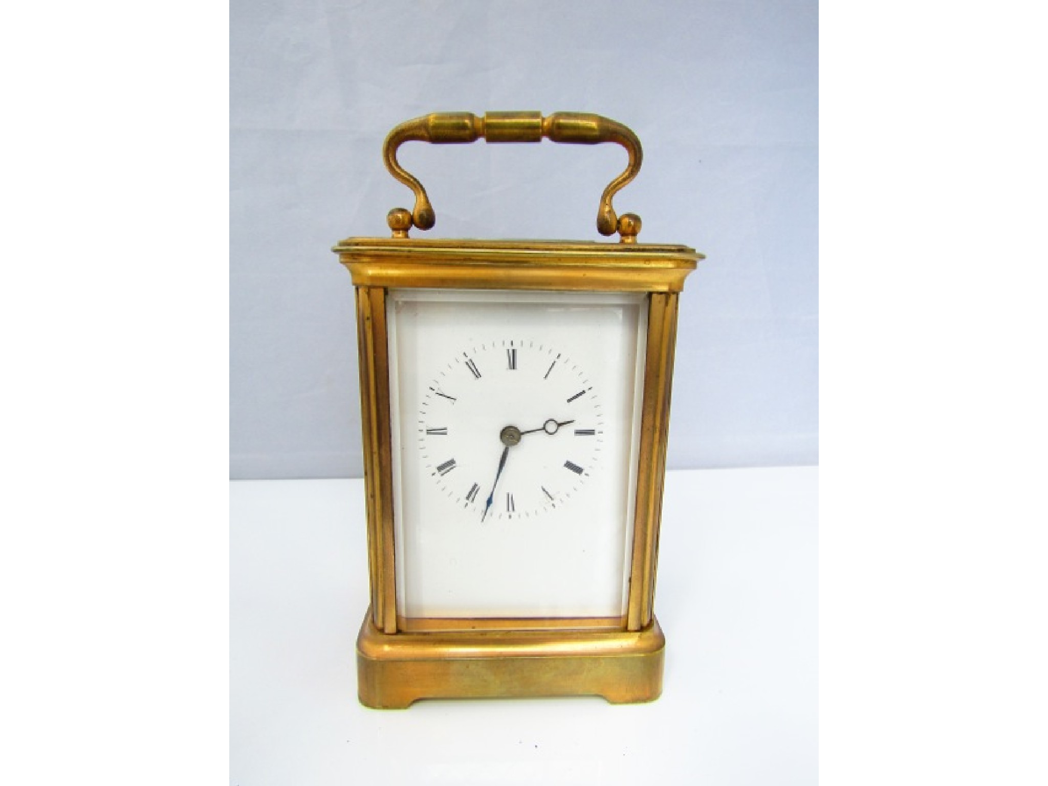 Appraisal: A brass carriage clock with enamel dial and day time