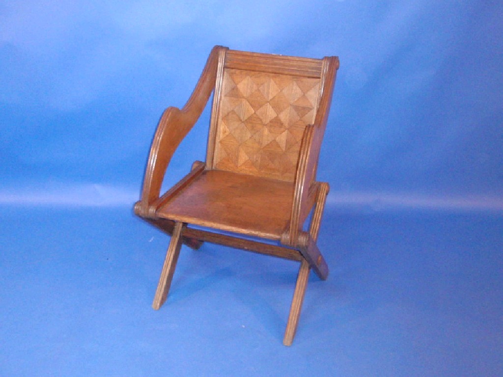 Appraisal: A Pugin design Glastonbury chair with parquetry backed panel with