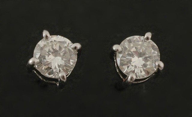 Appraisal: A pair of diamond stud earrings Each claw set round