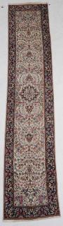 Appraisal: Kerman Runner floral designs on ivory ground cobalt major border