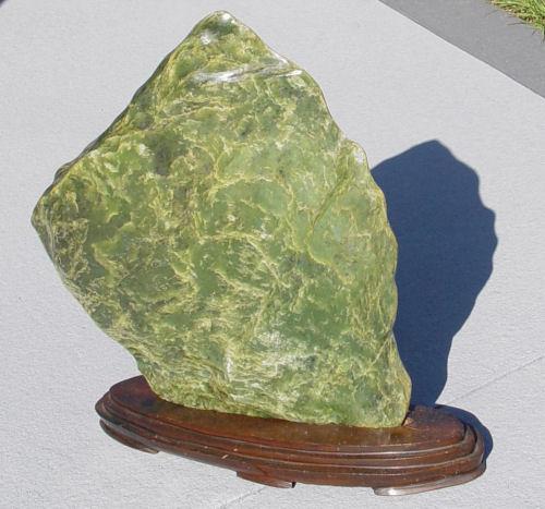 Appraisal: LARGE GREEN SERPENTINE STONE On wooden display stand Perfect for