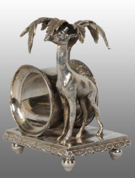 Appraisal: Tall Giraffe Under Palm Tree Figural Napkin Ring Description Marked