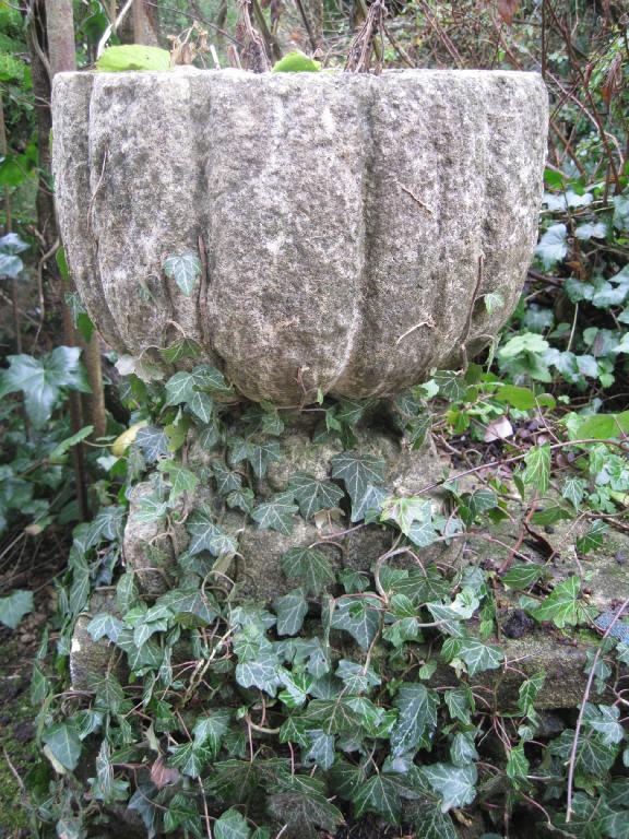 Appraisal: Pair of carved stone circular Urns of vertical fluted form