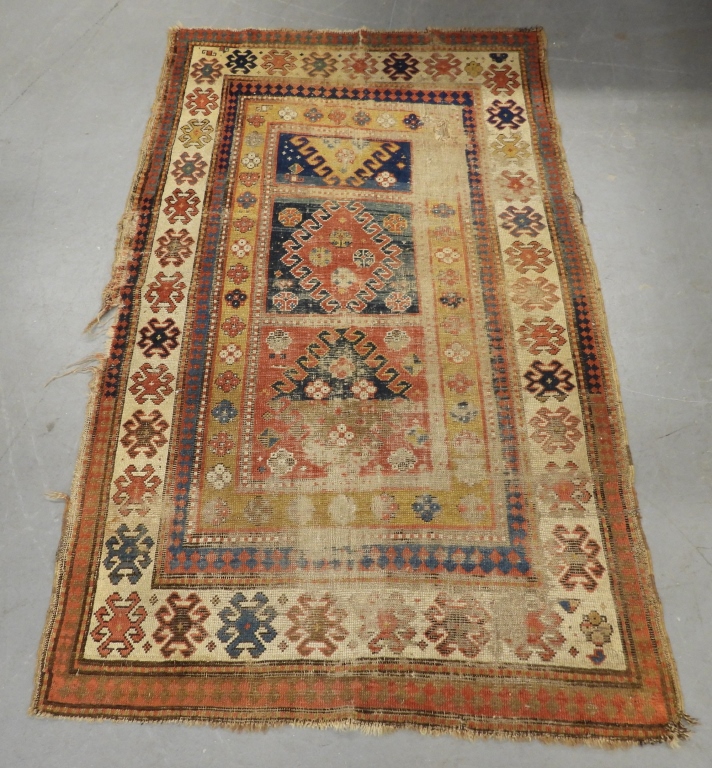 Appraisal: GEOMETRIC KAZAK RUG Middle East th CenturyRed navy blue yellow