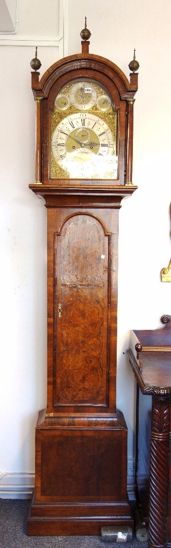 Appraisal: A George II eight day walnut and crossbanded longcase clock