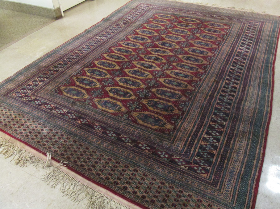 Appraisal: HAND KNOTTED BOKHARA CARPET India or Pakistan repeating columns of