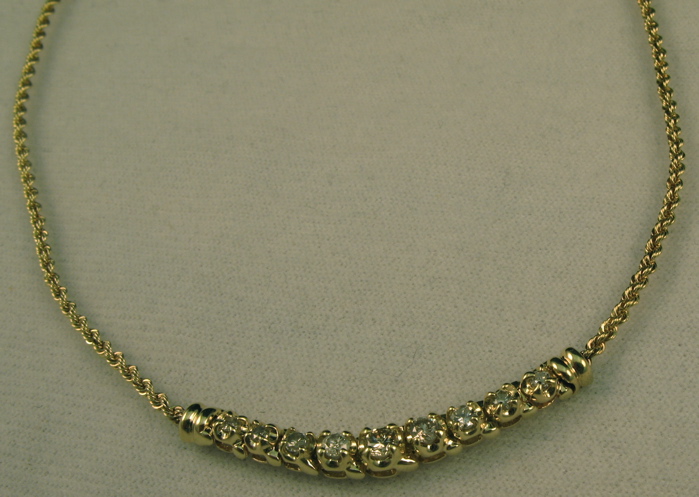 Appraisal: DIAMOND AND FOURTEEN KARAT GOLD NECKLACE inches in length and