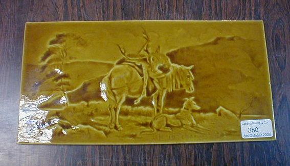 Appraisal: A yellow glazed picture tile - 'left in charge' a