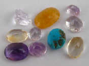 Appraisal: A quantity of loose polished gem stones including kunzite amethyst