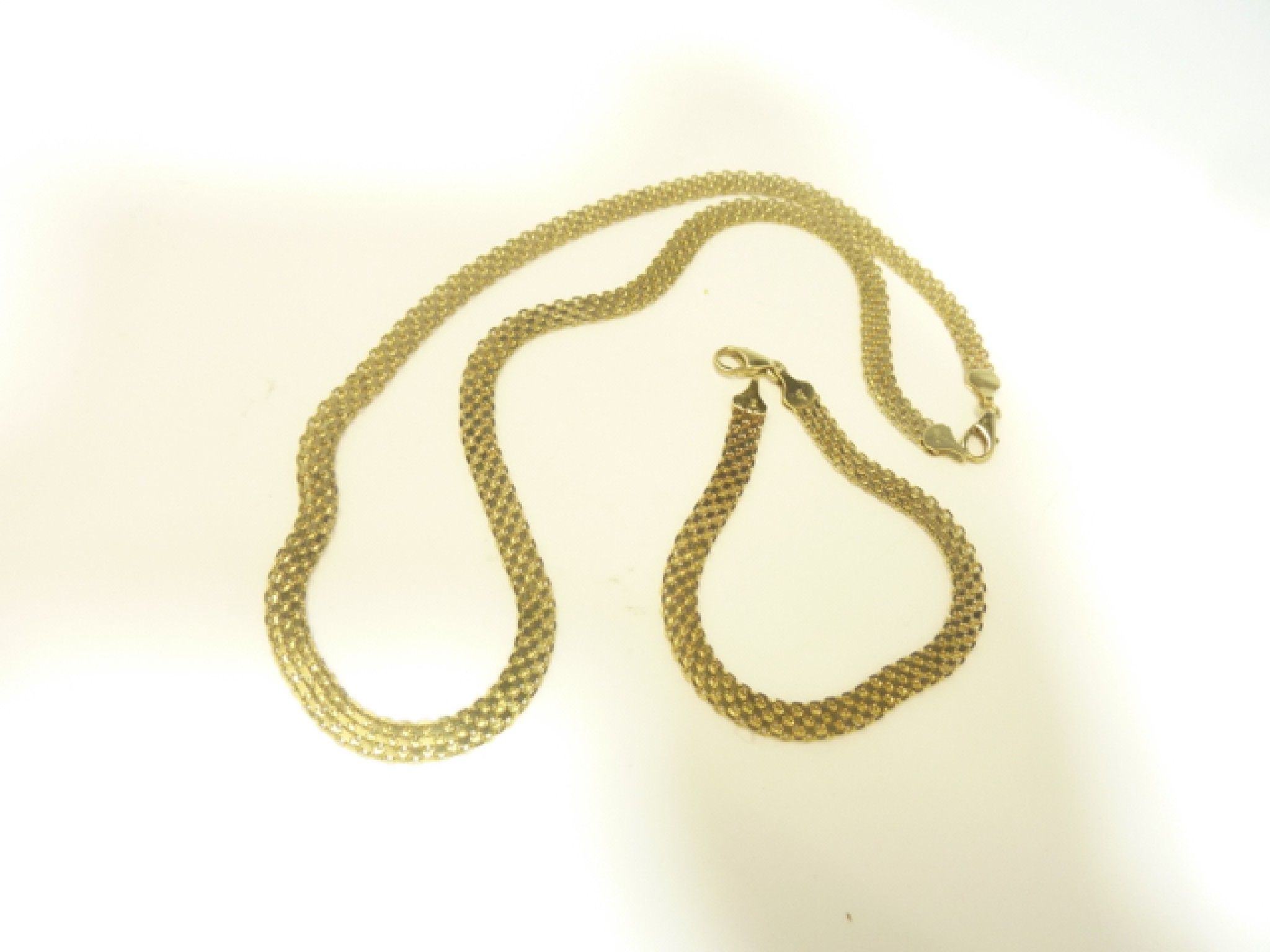 Appraisal: A ct gold necklace and matching bracelet Tufan g in