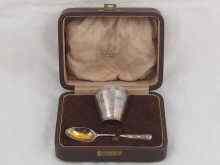 Appraisal: A silver egg cup and spoon by David Fullerton London