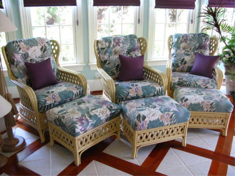 Appraisal: Rattan Wing Chairs with Ottomans light rattan frame with tropical