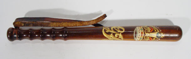 Appraisal: Walnut truncheon painted and gilded with an armorial crest and