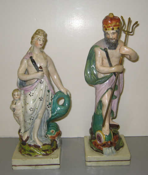 Appraisal: TWO ANTIQUE STAFFORDSHIRE POTTERY FIGURES Depicting Poseidon and Aphrodite with