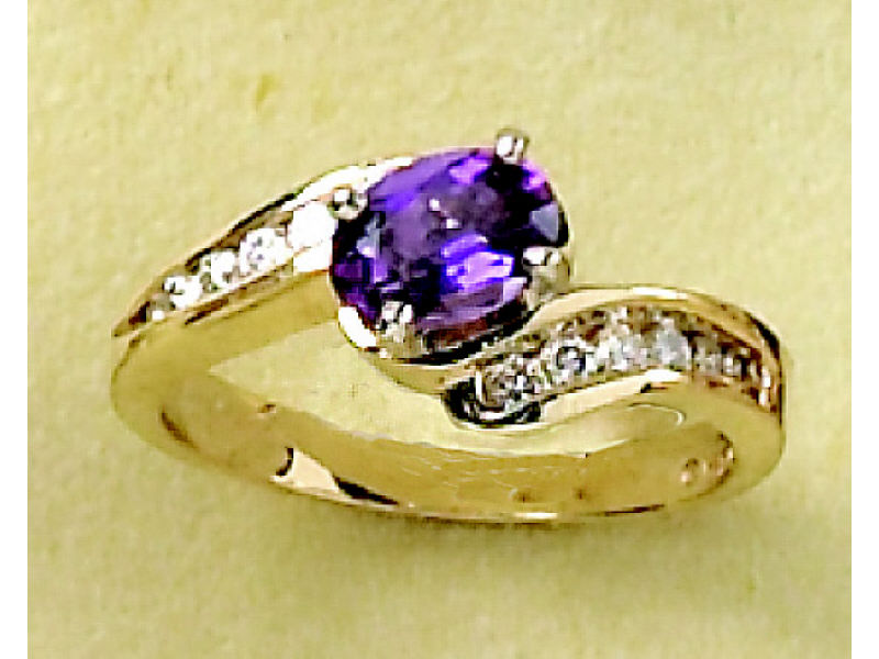 Appraisal: AMETHYST AND DIAMOND RING Lady's k gold bypass ring with