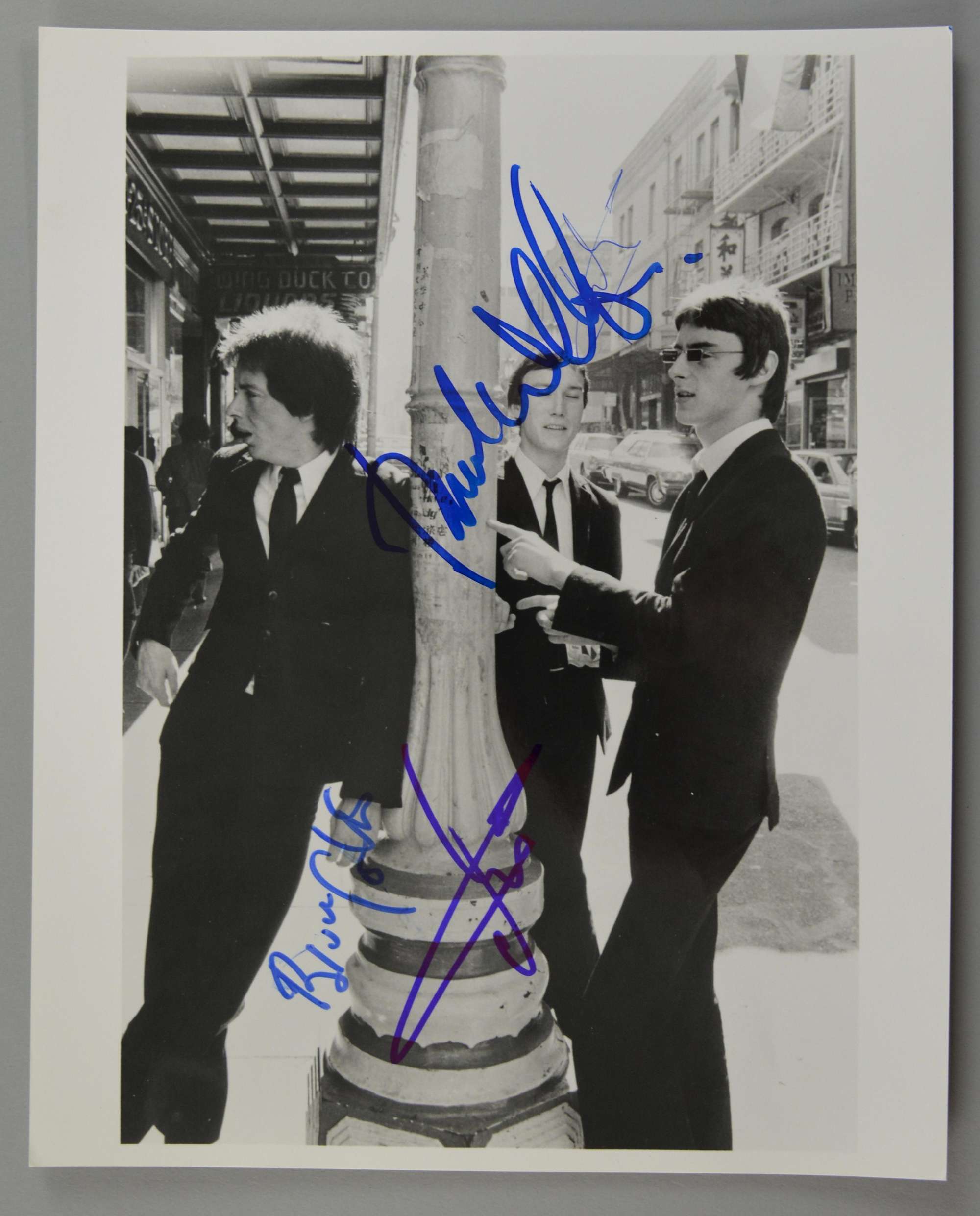 Appraisal: The Jam fully signed black white photograph including Paul Weller