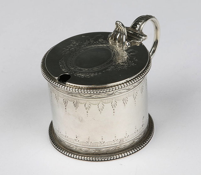 Appraisal: A VICTORIAN SILVER MUSTARD POT with beaded edges bright decoration