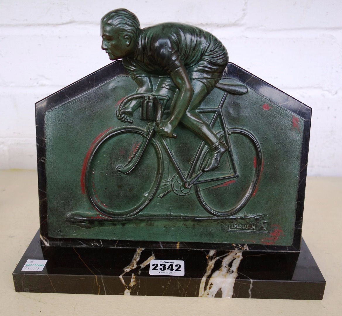 Appraisal: A Limousin cold painted spelter and marble 'cycling' desk panel