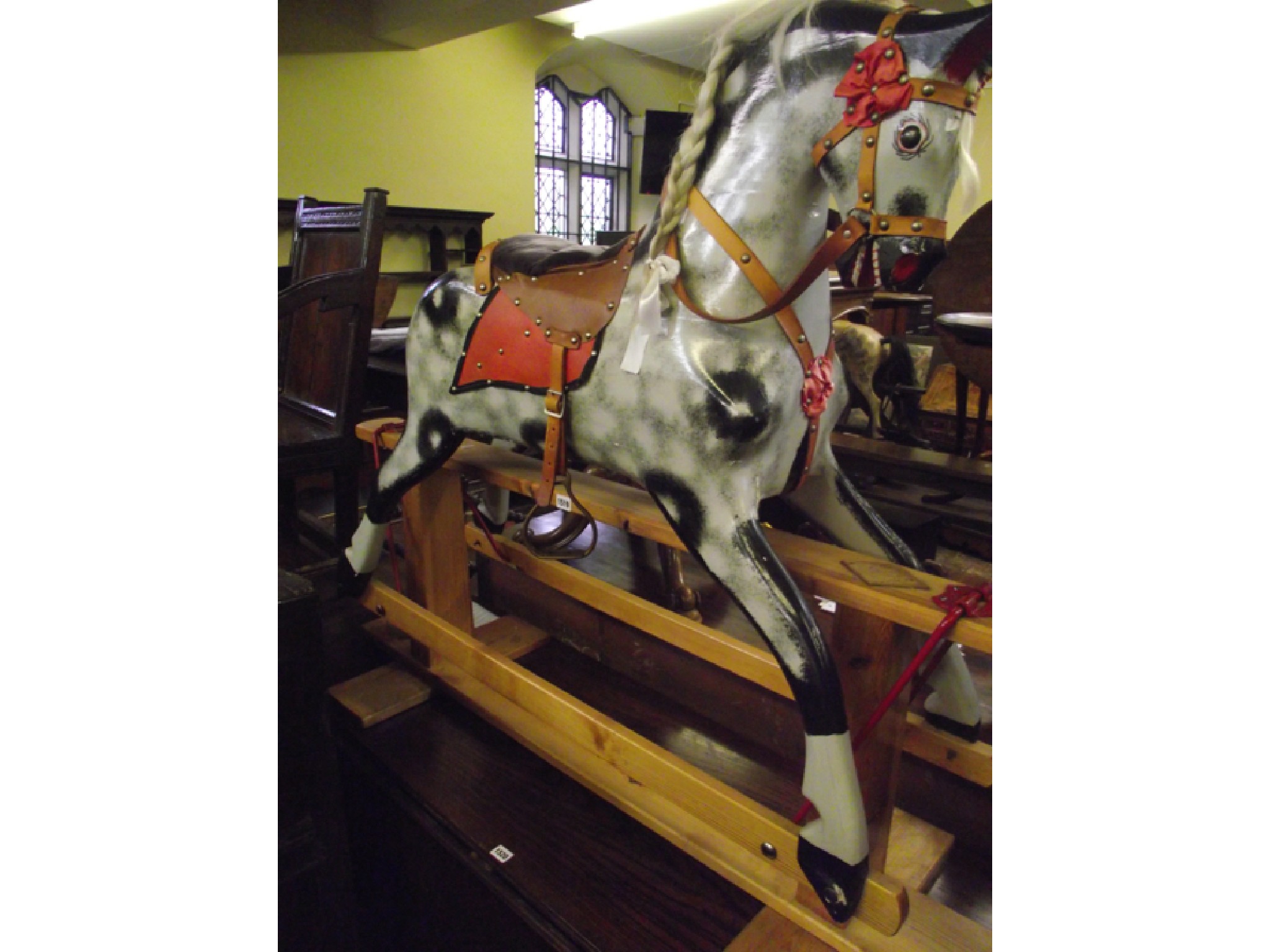 Appraisal: A contemporary dapple grey rocking horse by Collinson Son of