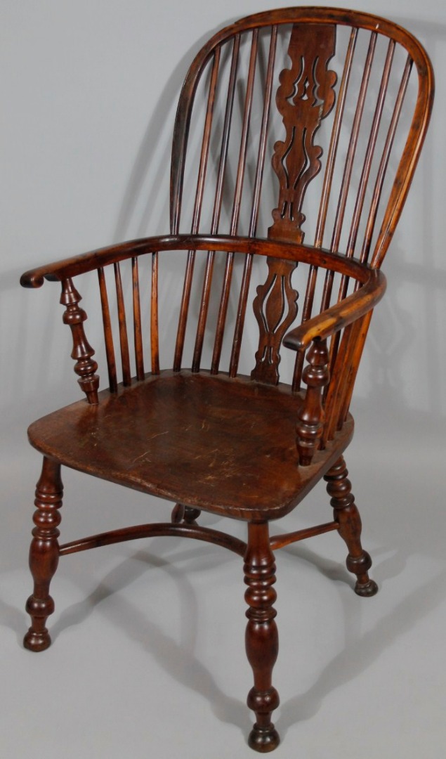 Appraisal: A thC yew and elm high back Windsor chair centred