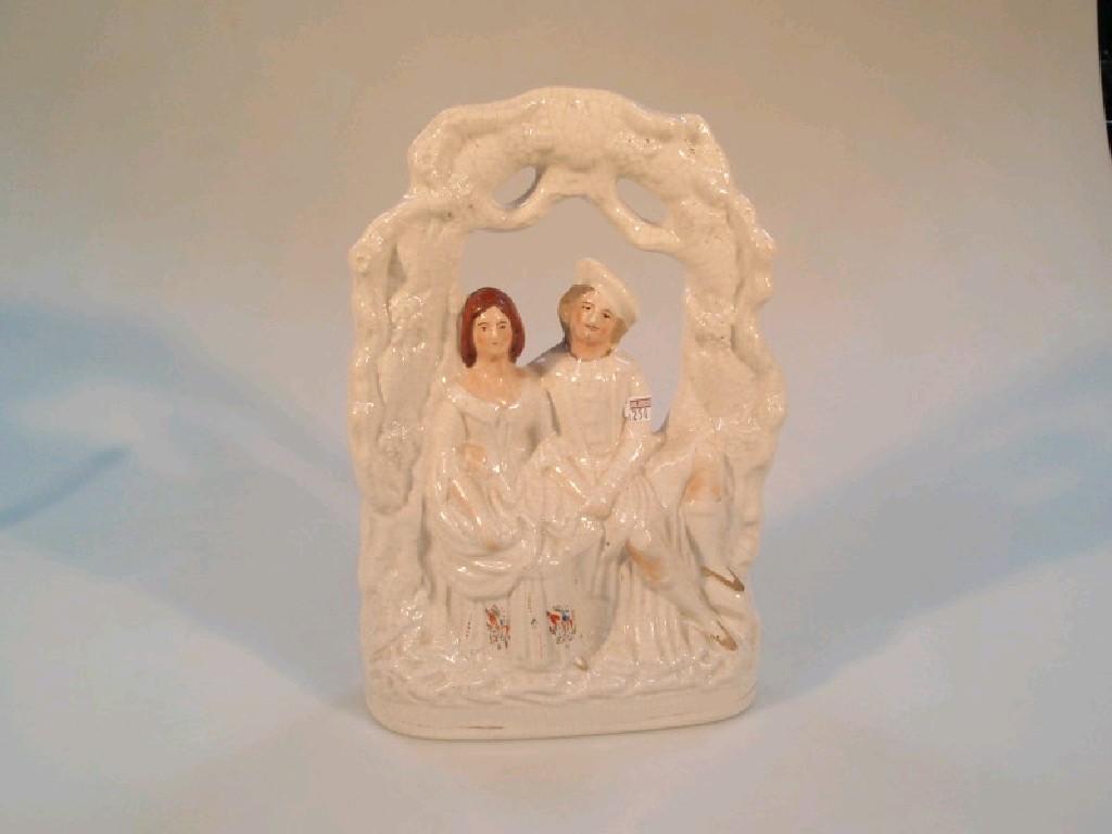 Appraisal: A thC Staffordshire pottery figure group of a courting couple