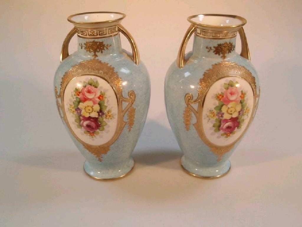 Appraisal: A pair of Noritake baulster vases with rose painted reserves