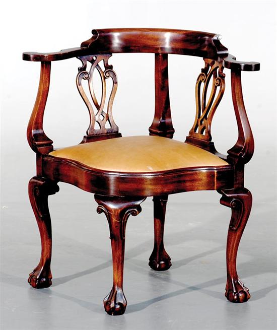 Appraisal: English mahogany corner chair continuous arm above double latticework splats