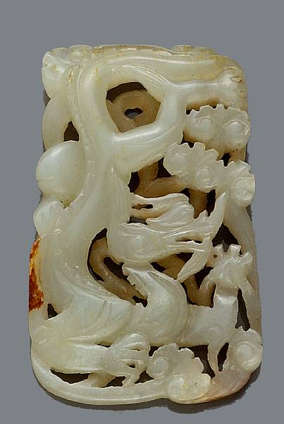 Appraisal: A reticulated jade dragon plaque Ming Dynasty Of rectangular section