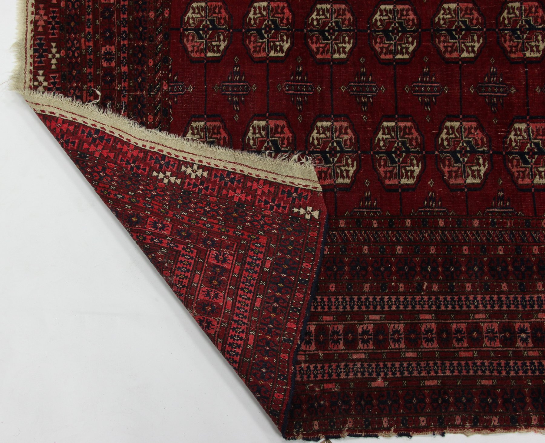 Appraisal: A Bokhara rug with three rows of twelve elephant foot