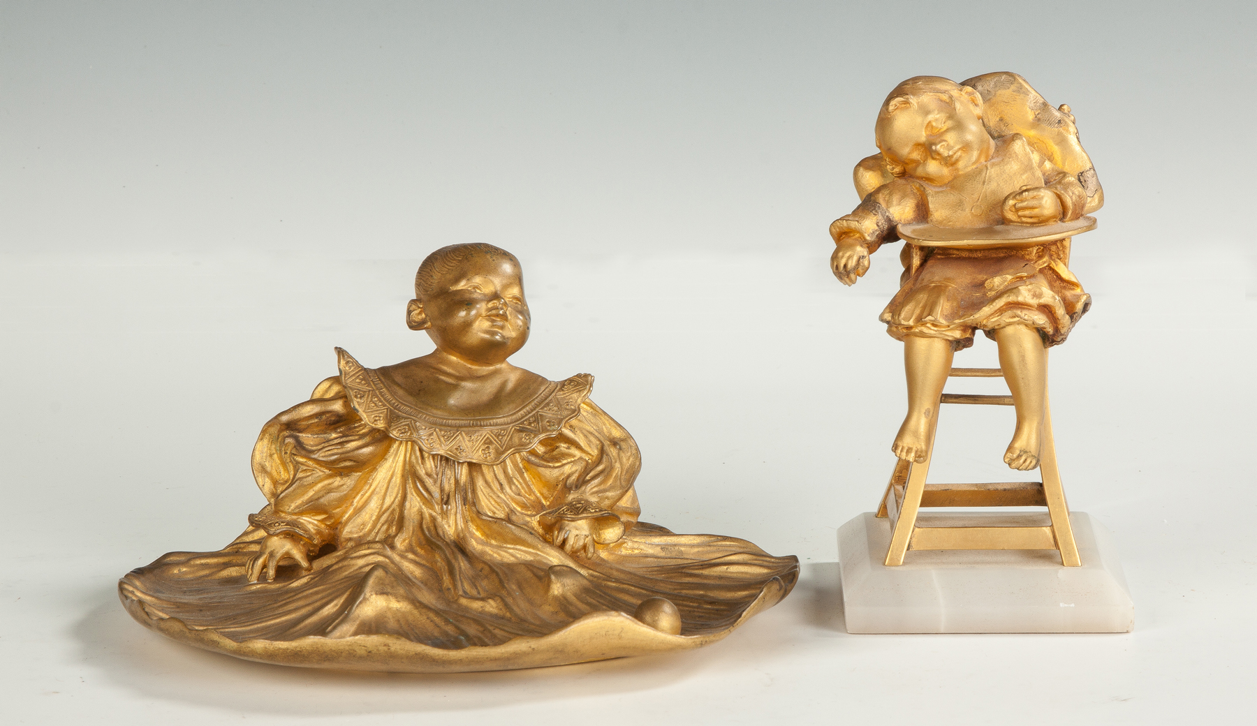 Appraisal: Patinaed Brass Inkwell Child in Highchair Sculpture L Stamped Paris