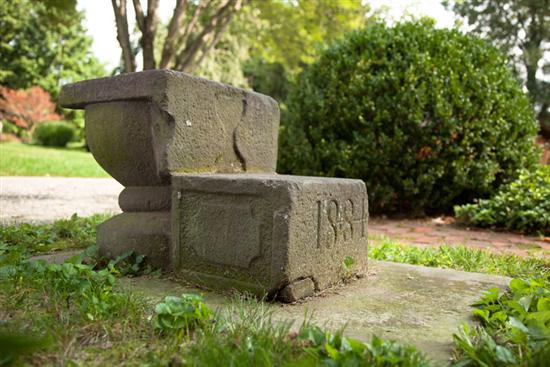 Appraisal: CARRIAGE STEPS American limestone One-piece carved carriage step with urn